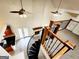 Aerial view from the staircase showcasing the living room, kitchen, and open layout of the home at 645 Crossbridge Aly, Johns Creek, GA 30022