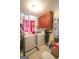 Functional laundry room with washer, dryer, overhead cabinets, and tile flooring at 3257 Greenvale Way, Decatur, GA 30034