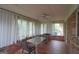 Bright sunroom with a ceiling fan and large windows at 3257 Greenvale Way, Decatur, GA 30034