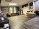 Spacious basement featuring a decorative fireplace, built-in shelving, and natural light at 4710 Meadowlark Se Dr, Conyers, GA 30094