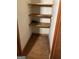 Empty closet featuring shelving and hardwood flooring at 8395 Rivertown Rd, Fairburn, GA 30213