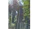 View of corner home exterior, covered in trees at 8395 Rivertown Rd, Fairburn, GA 30213