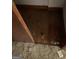 Damaged hardwood floors next to shag carpet with debris in a neglected room at 8395 Rivertown Rd, Fairburn, GA 30213