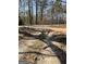 View of a quiet country road with trees lining the way at 8395 Rivertown Rd, Fairburn, GA 30213