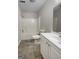 A bathroom featuring a shower-tub combo, toilet, and vanity with a modern, clean design at 7747 Roundtree Xing, Riverdale, GA 30274
