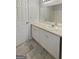 Bright bathroom with a white vanity, ample storage, and a well-lit mirror at 7747 Roundtree Xing, Riverdale, GA 30274