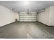 Spacious two-car garage with concrete floor and automatic door opener at 7747 Roundtree Xing, Riverdale, GA 30274