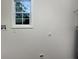 A view of the laundry room with window at 7747 Roundtree Xing, Riverdale, GA 30274