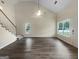 Bright living room with vaulted ceiling and large windows allowing ample natural light at 7747 Roundtree Xing, Riverdale, GA 30274