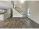 A spacious living room featuring high ceilings, a ceiling fan, wood flooring, and natural light at 7747 Roundtree Xing, Riverdale, GA 30274