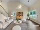 Bright living room with vaulted ceiling, stylish furnishings, and ample natural light at 7747 Roundtree Xing, Riverdale, GA 30274