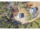 Aerial view of home with grey roof and white siding surrounded by many trees at 140 Wesley Pl, Fayetteville, GA 30214
