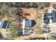 Aerial view of two modern homes surrounded by a lot of trees and long winding driveways at 140 Wesley Pl, Fayetteville, GA 30214