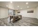 Spacious basement featuring wood-look floors and a pool table, complemented by an outside entrance at 140 Wesley Pl, Fayetteville, GA 30214