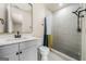 Charming bathroom featuring a gray vanity, walk-in shower, and modern fixtures at 140 Wesley Pl, Fayetteville, GA 30214