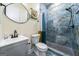 Modern bathroom features blue tile, walk-in shower, and updated fixtures at 140 Wesley Pl, Fayetteville, GA 30214