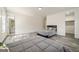 Large bedroom with wood-look floors, two windows, and access to an ensuite bathroom at 140 Wesley Pl, Fayetteville, GA 30214