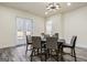 Dining room with light wood floors, a modern table with six chairs, and a modern chandelier at 140 Wesley Pl, Fayetteville, GA 30214