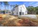Angle exterior with two car garage with modern style smoked glass doors and long driveway at 140 Wesley Pl, Fayetteville, GA 30214