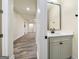 Hallway with wood flooring and a half bath at 140 Wesley Pl, Fayetteville, GA 30214