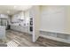 Modern kitchen with stainless steel appliances and a built-in mudroom storage area at 140 Wesley Pl, Fayetteville, GA 30214