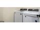 Convenient laundry room with a white, modern washing machine and dryer at 140 Wesley Pl, Fayetteville, GA 30214