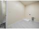 Bright laundry room with white walls and floors, ready for appliances at 140 Wesley Pl, Fayetteville, GA 30214