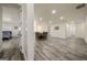 Expansive living area features wood-look flooring and recessed lighting, offering versatile living or entertainment space at 140 Wesley Pl, Fayetteville, GA 30214