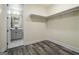 Adjacent to the bathroom, the walk-in closet features shelves, wood-look floors and ample storage space at 140 Wesley Pl, Fayetteville, GA 30214