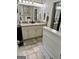 Bathroom featuring double sinks, granite countertops and neutral color palette at 55 Long Dr, Covington, GA 30016