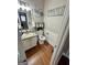 Powder room featuring granite countertops, modern vanity, and decorative accents at 55 Long Dr, Covington, GA 30016