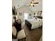 Bedroom featuring neutral carpeting and decor, with a ceiling fan and ample natural light at 55 Long Dr, Covington, GA 30016