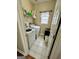 Functional laundry room equipped with a washer, dryer, and ample storage space at 55 Long Dr, Covington, GA 30016
