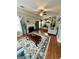 Inviting living room showcasing a fireplace, plush rug, and seamless flow into the kitchen at 55 Long Dr, Covington, GA 30016
