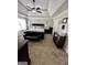 Large main bedroom featuring a tray ceiling, ceiling fan, and sitting area at 55 Long Dr, Covington, GA 30016