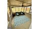 Relaxing sunroom featuring two cushioned chairs and an area rug overlooking the yard at 55 Long Dr, Covington, GA 30016