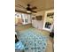 Sunroom featuring neutral walls, a ceiling fan, and a patterned area rug at 55 Long Dr, Covington, GA 30016