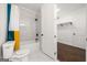 Bright bathroom with a tiled shower and a peek into a walk-in closet at 130 Wesley Pl, Fayetteville, GA 30214