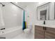 Modern bathroom showcasing marble-look shower and sleek vanity at 130 Wesley Pl, Fayetteville, GA 30214