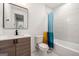 Modern bathroom with marble-look shower, white toilet, and sleek vanity at 130 Wesley Pl, Fayetteville, GA 30214