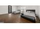 Spacious bedroom features hardwood floors and two beds at 130 Wesley Pl, Fayetteville, GA 30214