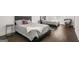 Comfortable bedroom featuring two beds and hardwood floors with plenty of natural light at 130 Wesley Pl, Fayetteville, GA 30214