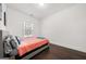 Minimalist bedroom with hardwood floors, neutral colors, and natural light from a window at 130 Wesley Pl, Fayetteville, GA 30214