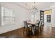 Dining room with modern chandelier and lots of natural light at 130 Wesley Pl, Fayetteville, GA 30214