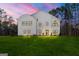 Stunning modern farmhouse with black trim windows and a beautiful green lawn at 130 Wesley Pl, Fayetteville, GA 30214