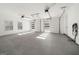 Spacious three car garage with white doors and gray epoxy flooring at 130 Wesley Pl, Fayetteville, GA 30214