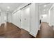 Hallway with barn door leading to laundry room at 130 Wesley Pl, Fayetteville, GA 30214