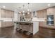 Modern kitchen with a waterfall island, stainless steel appliances, and pendant lighting at 130 Wesley Pl, Fayetteville, GA 30214