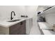 Well-lit laundry room with modern sink, countertop, storage, and washer/dryer at 130 Wesley Pl, Fayetteville, GA 30214