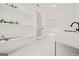 Well-organized laundry room with white shelves, storage, and a modern sink and countertop at 130 Wesley Pl, Fayetteville, GA 30214